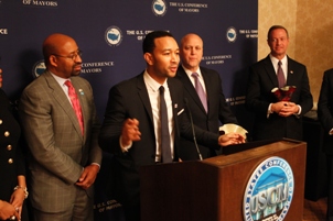 John Legend speaks while receiving a Citizen Artist Award from The United States Conference of Mayors and Americans for the Arts. Also picture are Philadelphia Mayor Micheal Nutter (left), New Orleans Mayor Mitch Landrieu, and Maryland Gov. Martin O'Malley.