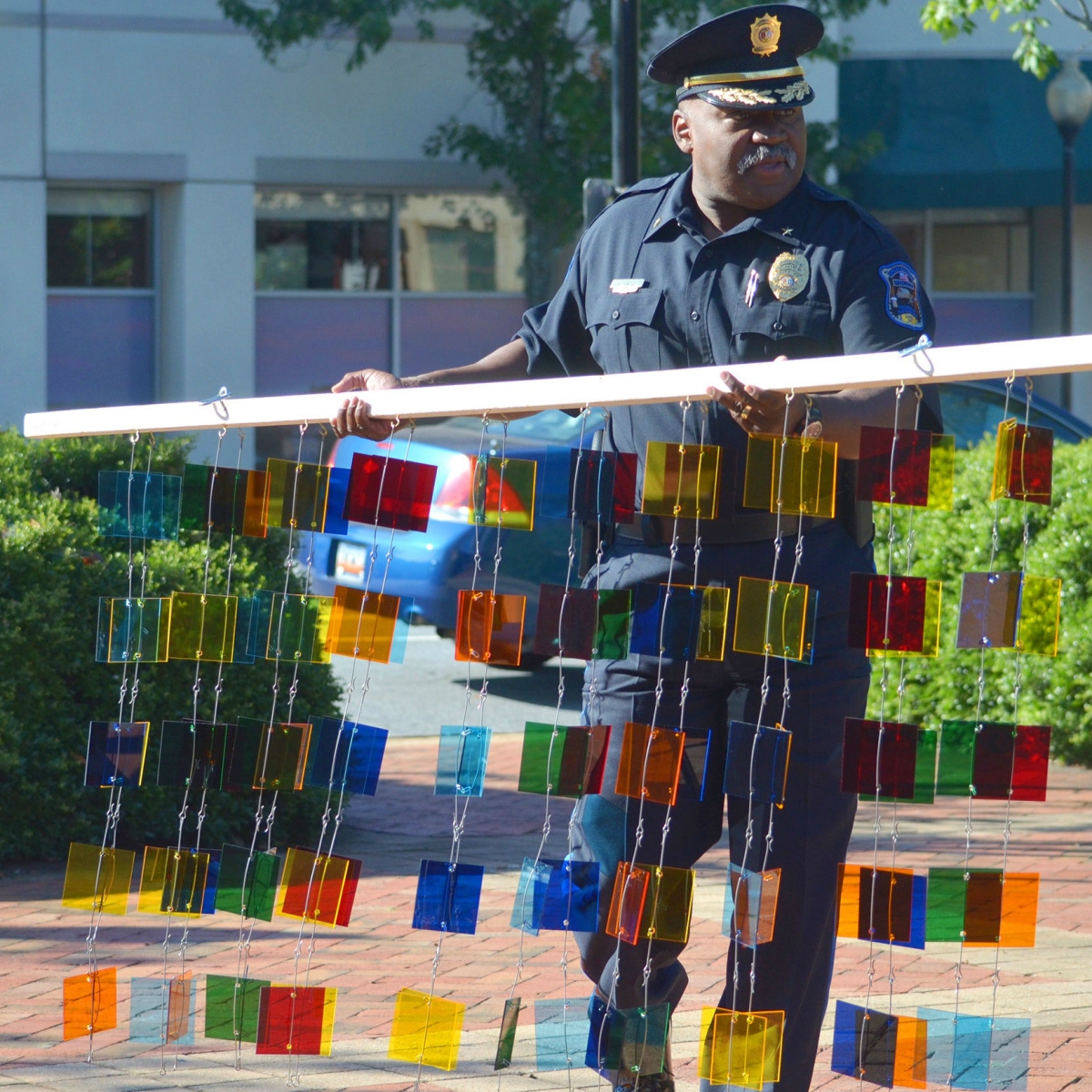 City of Spartanburg, Chief of Police Alonzo Thompson helping to assemble Downtown Mobile Suspension photo taken by Luke Connell, The Palladian Group.