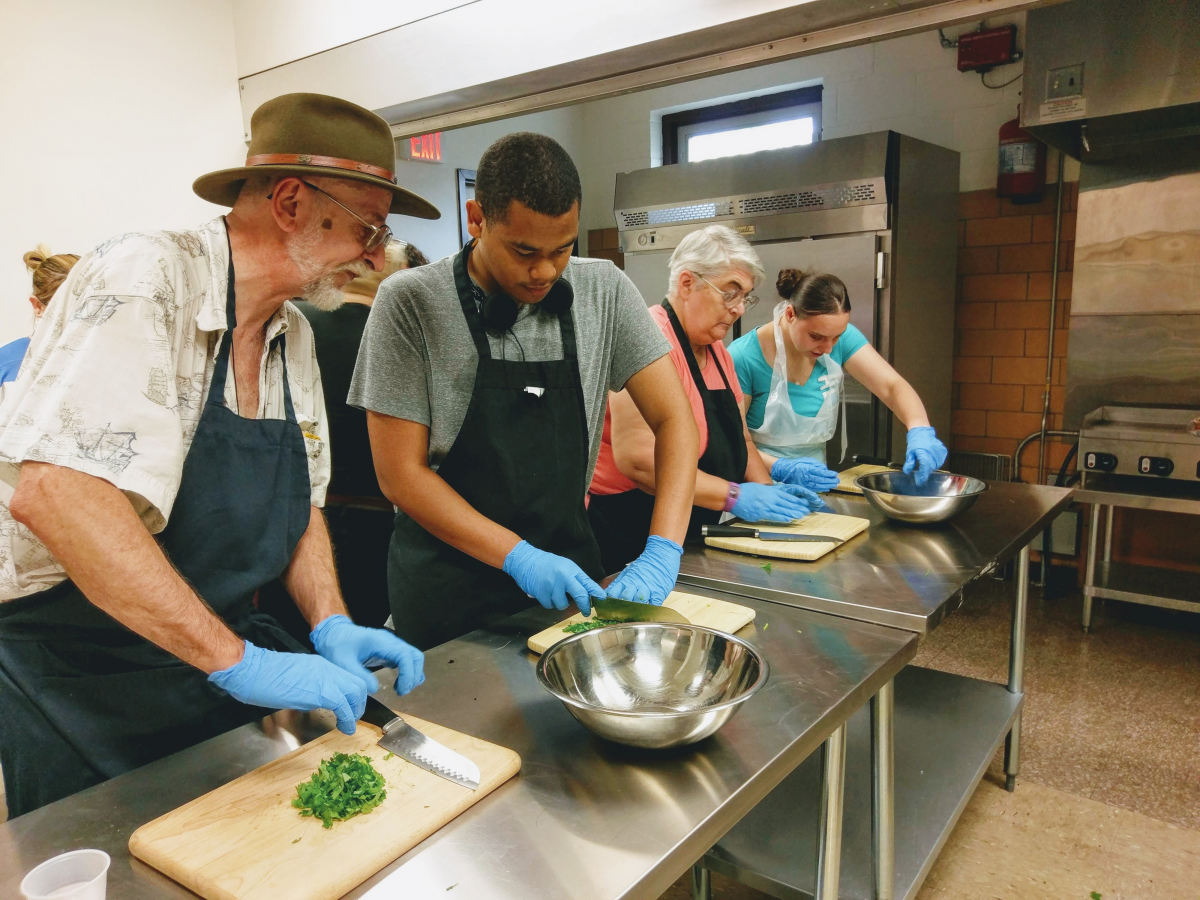 Seniors and youth learned to cook at the United Neighborhood Oppenheim Center for the Arts as part of “Let’s Cook!” Intergenerationial Cooking Program.