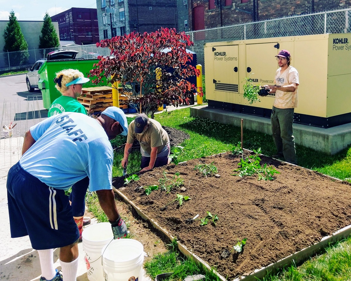 Veterans from the St. Francis Commons, a center for formerly homeless veterans in transition, build a garden with Master Gardners from Penn State Cooperative Extension.
