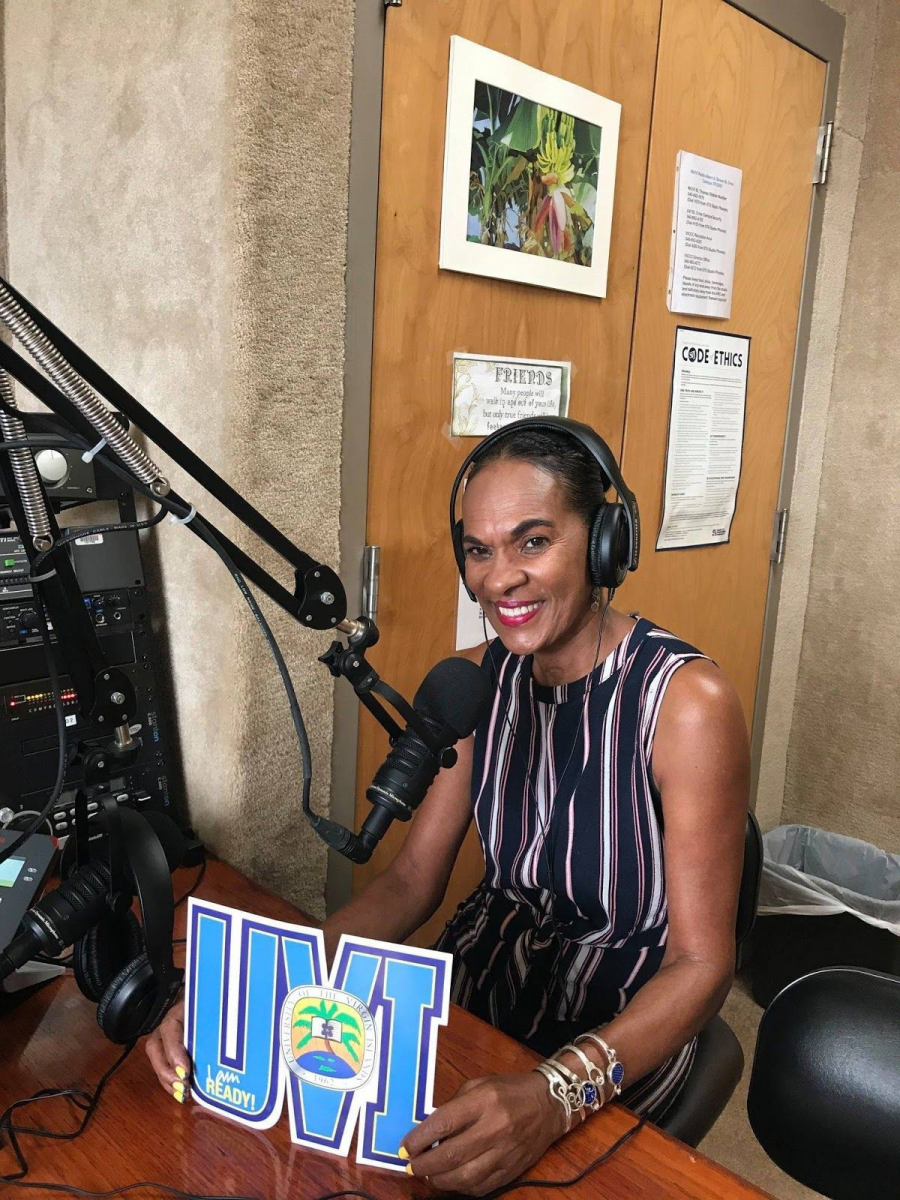 Charlita Schuster giving an interview at WUVI Radio Station in March 2019 talking about the progress that has been made in her community since Hurricanes Irma and Maria.