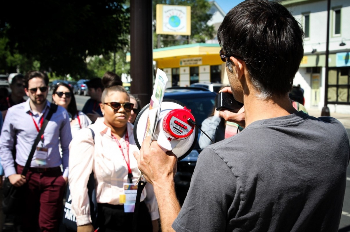 Eduardo, a community organizer and theatre employee, takes Convention attendees on a tour of the 38th and Chicago St. corridor to demonstrate how art has changed the area. 