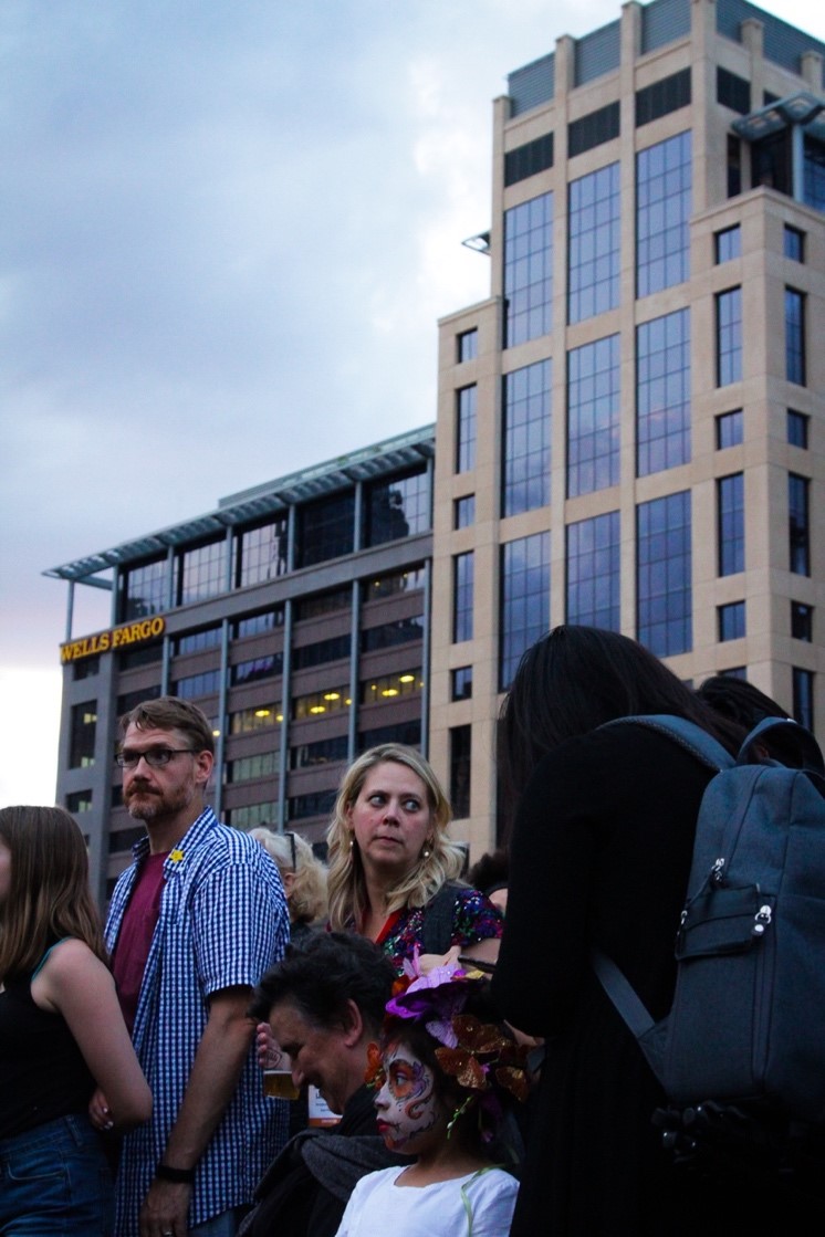 Convention attendees, locals, and performers mingle while waiting for the festival’s opening ceremony in the Commons area of downtown Minneapolis. 