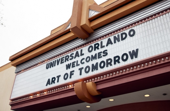 A theater marquee displays the message 'Universal Orlando Welcomes Art of Tomorrow'